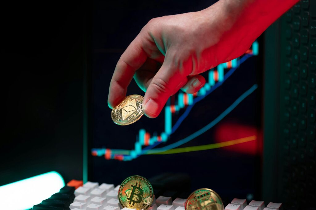 Global Crypto Regulations: What You Need to Know A hand holding cryptocurrency coins with a financial chart in the background, depicting market trends.