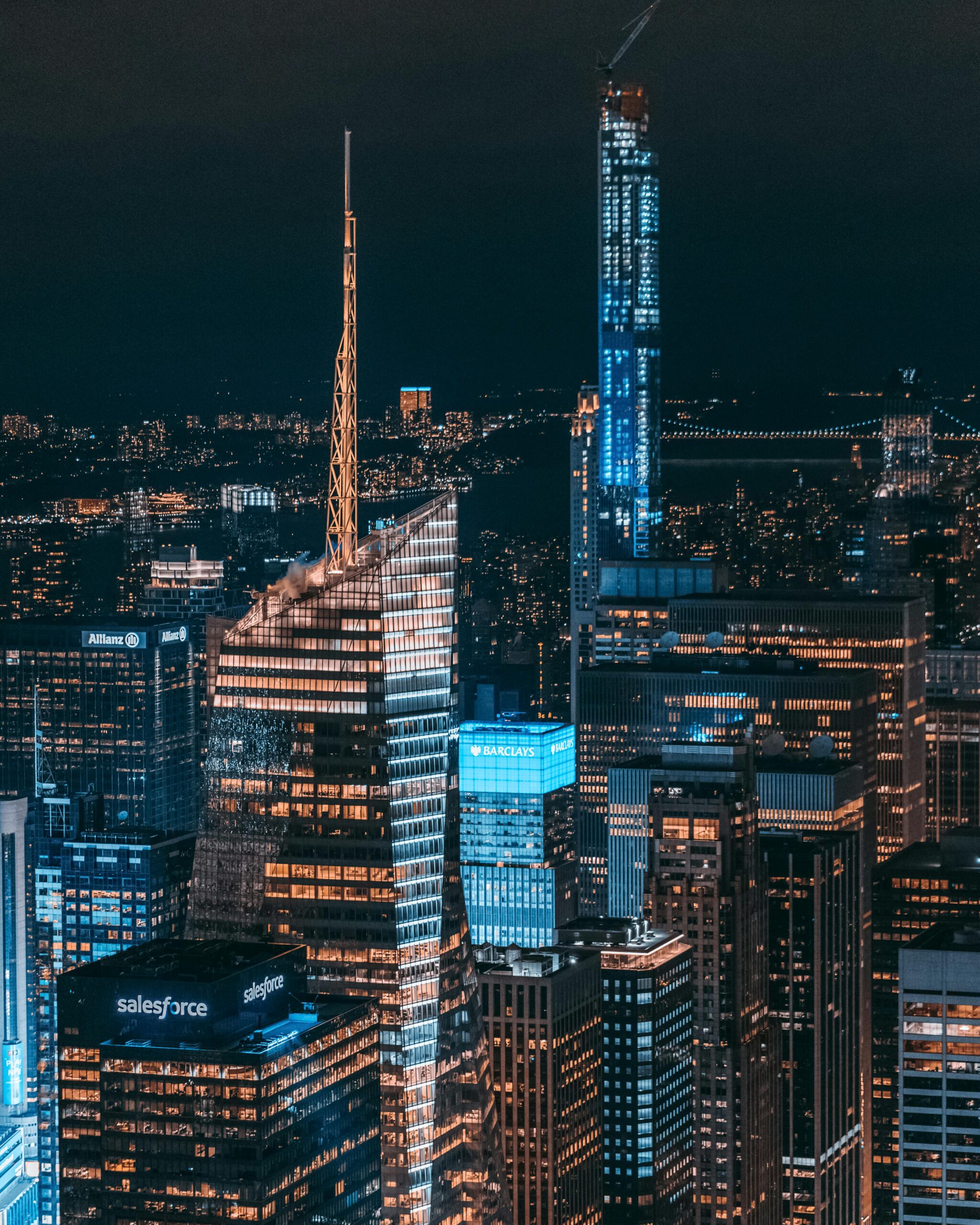 A captivating aerial view of New York City's glowing skyscrapers at night.